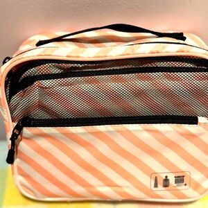 New Travel wise Pink and White Striped Cosmetic Bag with black mesh.
